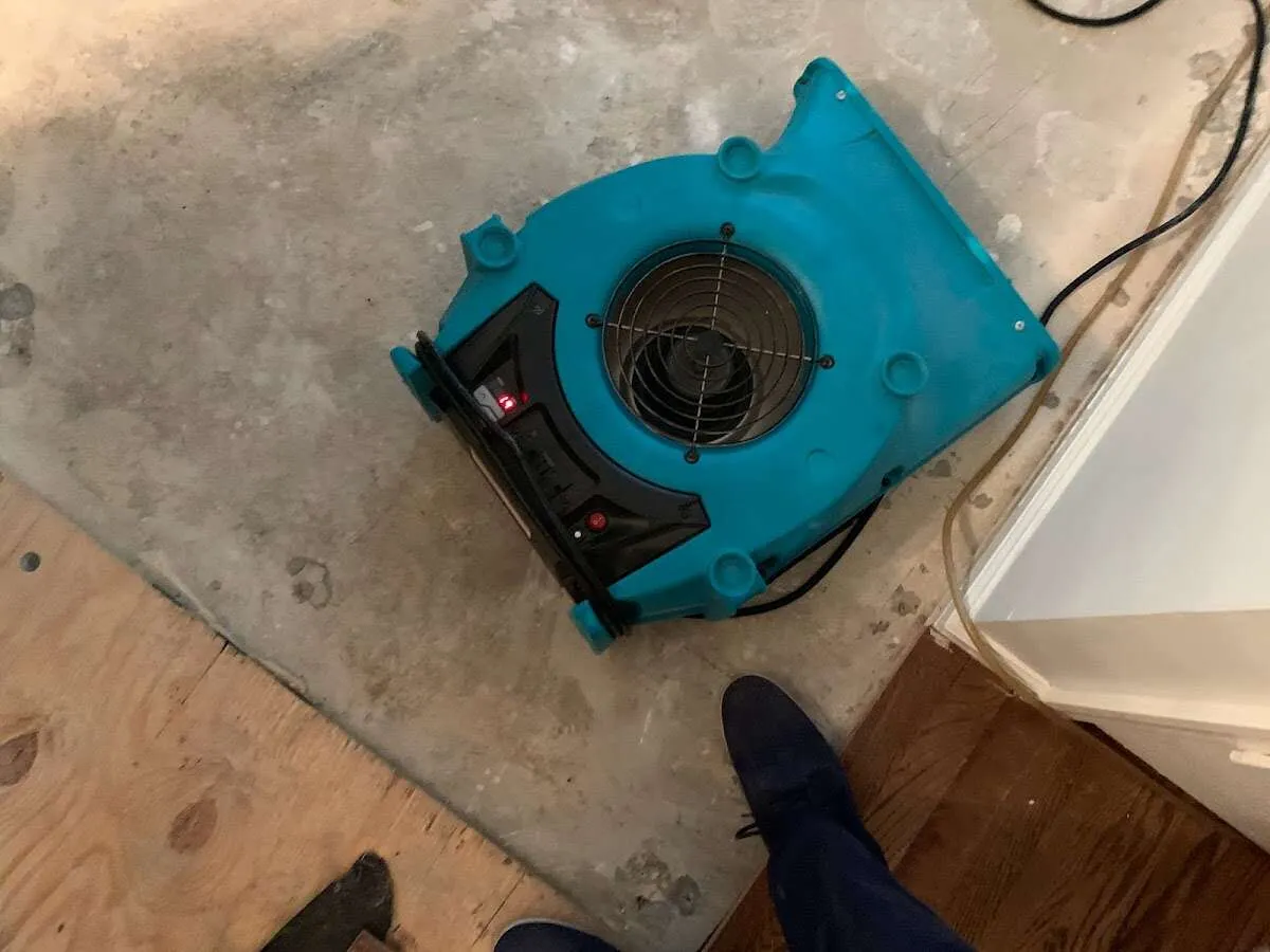 Air mover drying subfloor during Commercial Water Damage Restoration in Casas Adobes